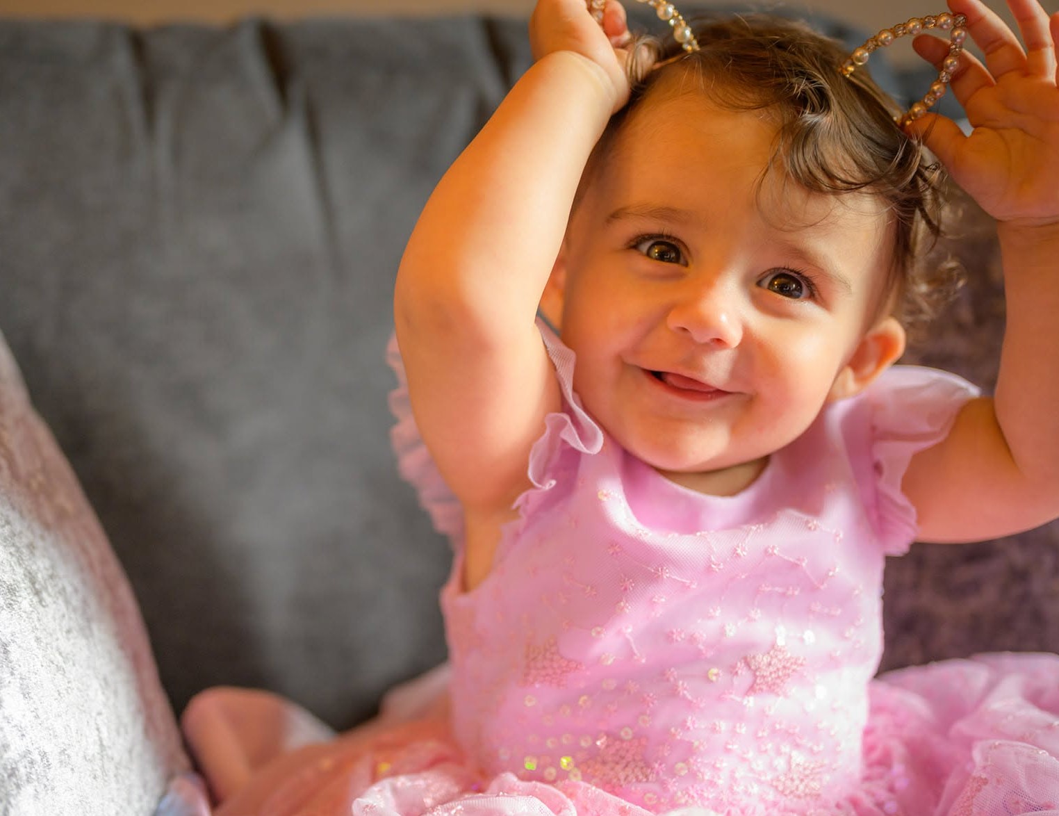 A young girl smiling at the camera after getting ready for a wedding